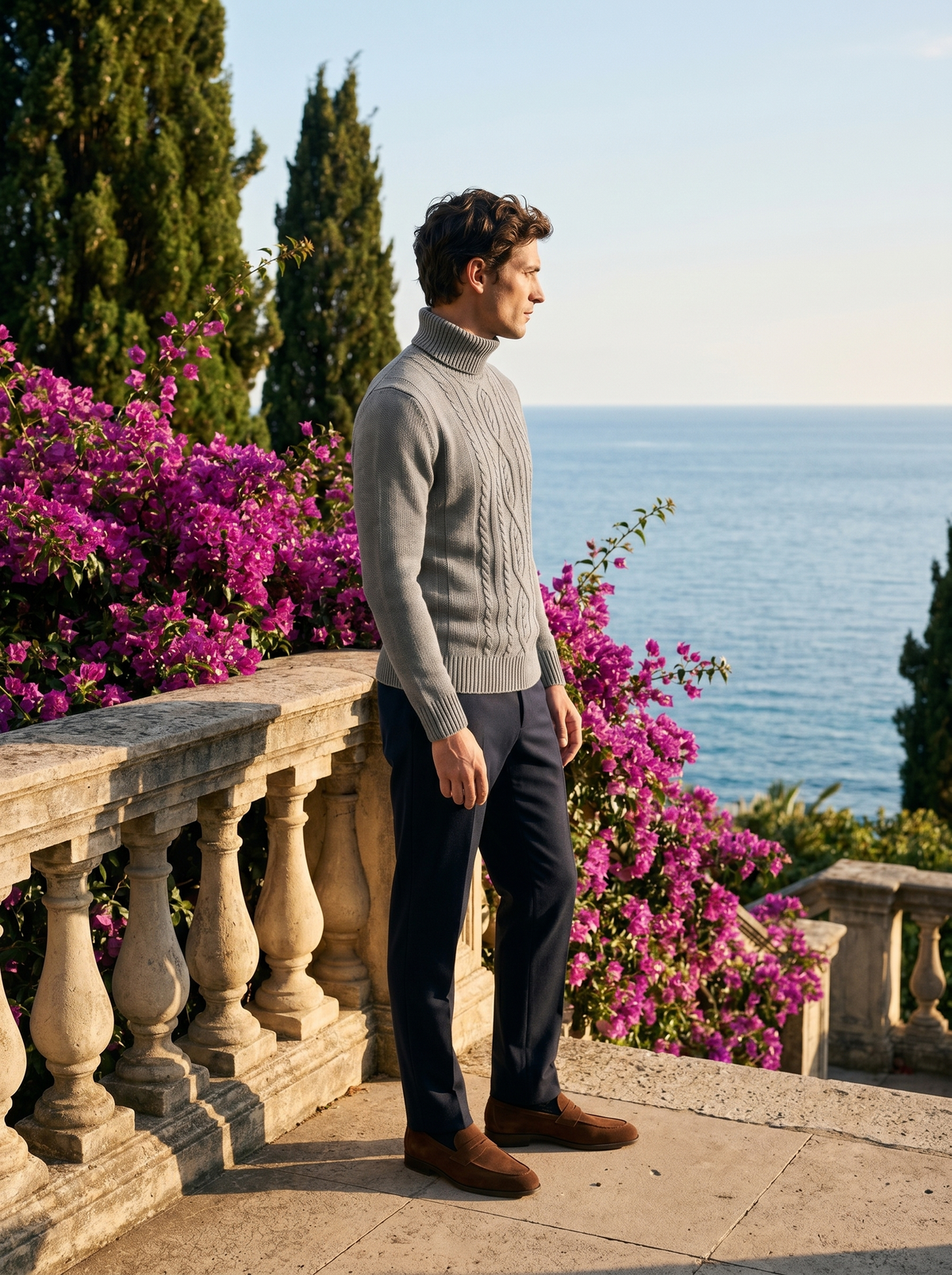 Side profile of a man wearing a cable knit wool roll neck jumper overlooking Lake Como — Belvoirne