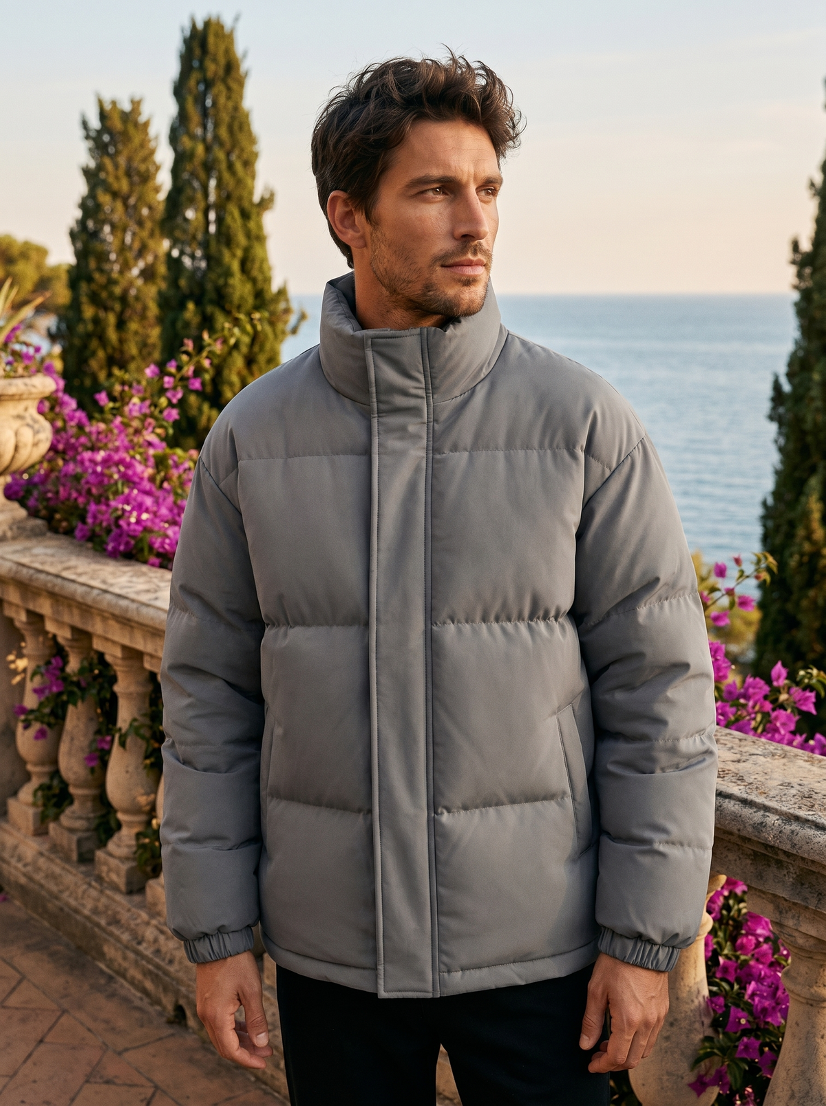 Man wearing a puffer jacket on a Lake Como terrace, old money style — Belvoirne