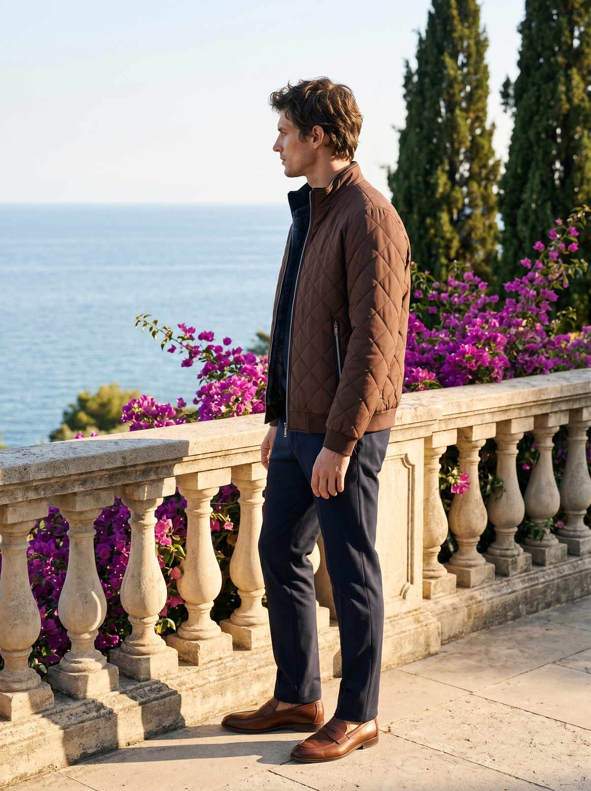 Side profile of a man wearing a fleece-lined quilted jacket overlooking Lake Como — Belvoirne