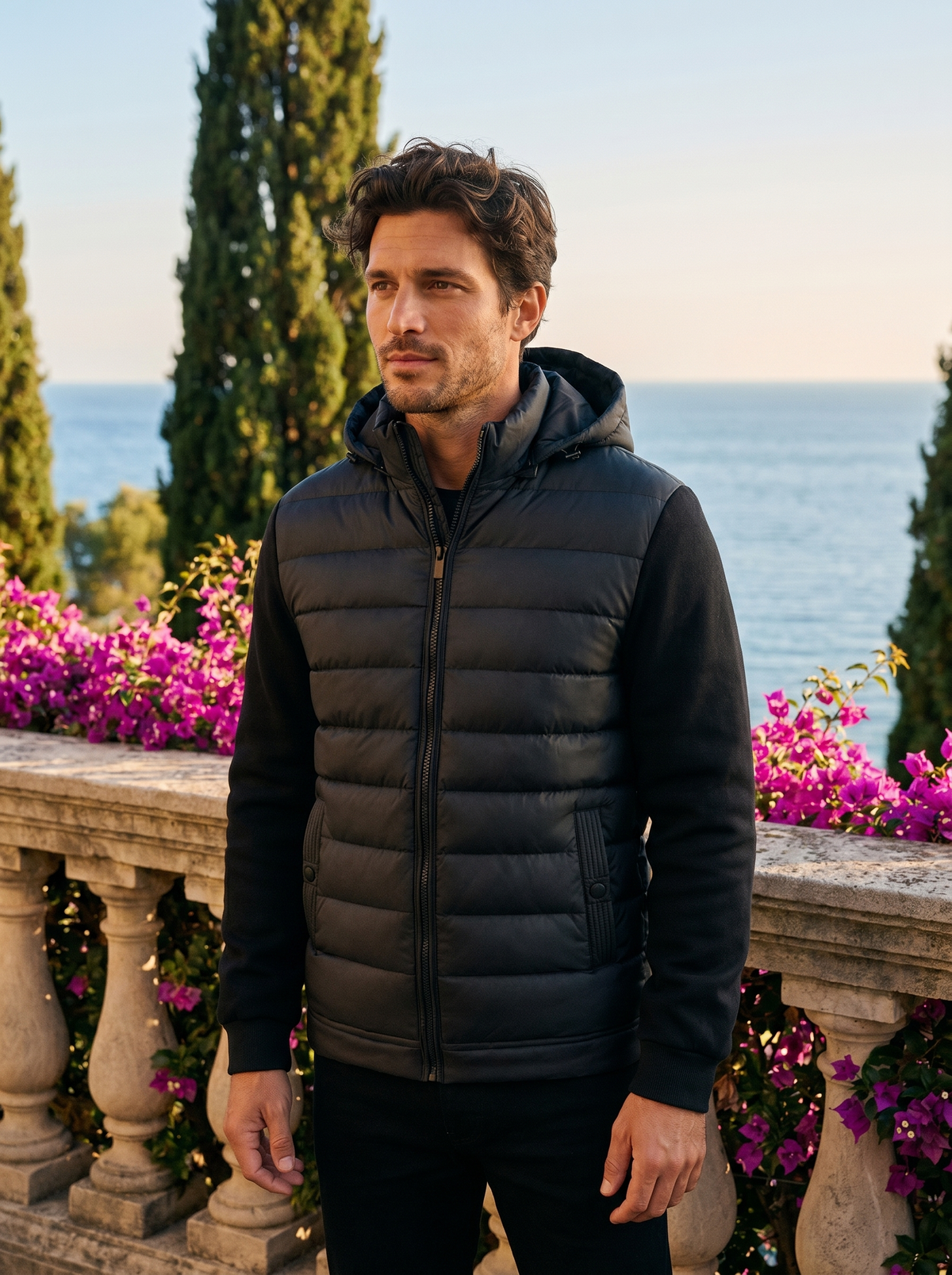 Man wearing a hooded puffer jacket on a Lake Como terrace, old money style — Belvoirne
