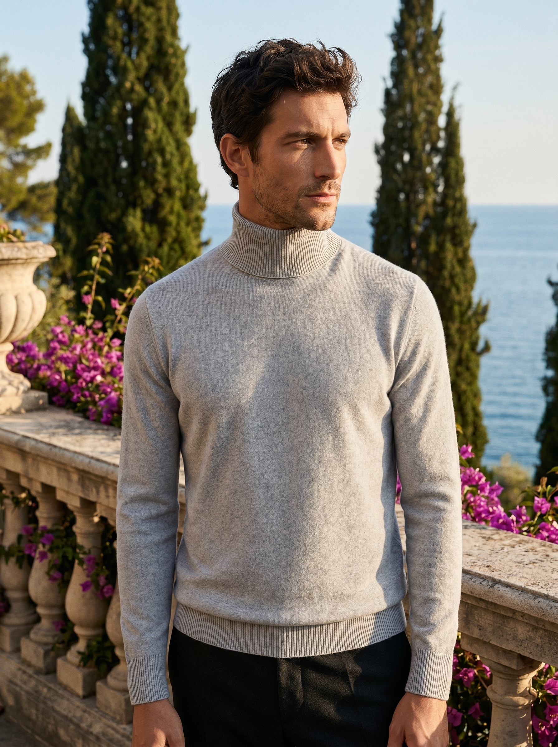 Man wearing a light grey pure wool roll neck jumper on a balcony overlooking Lake Como, old money style — Belvoirne
