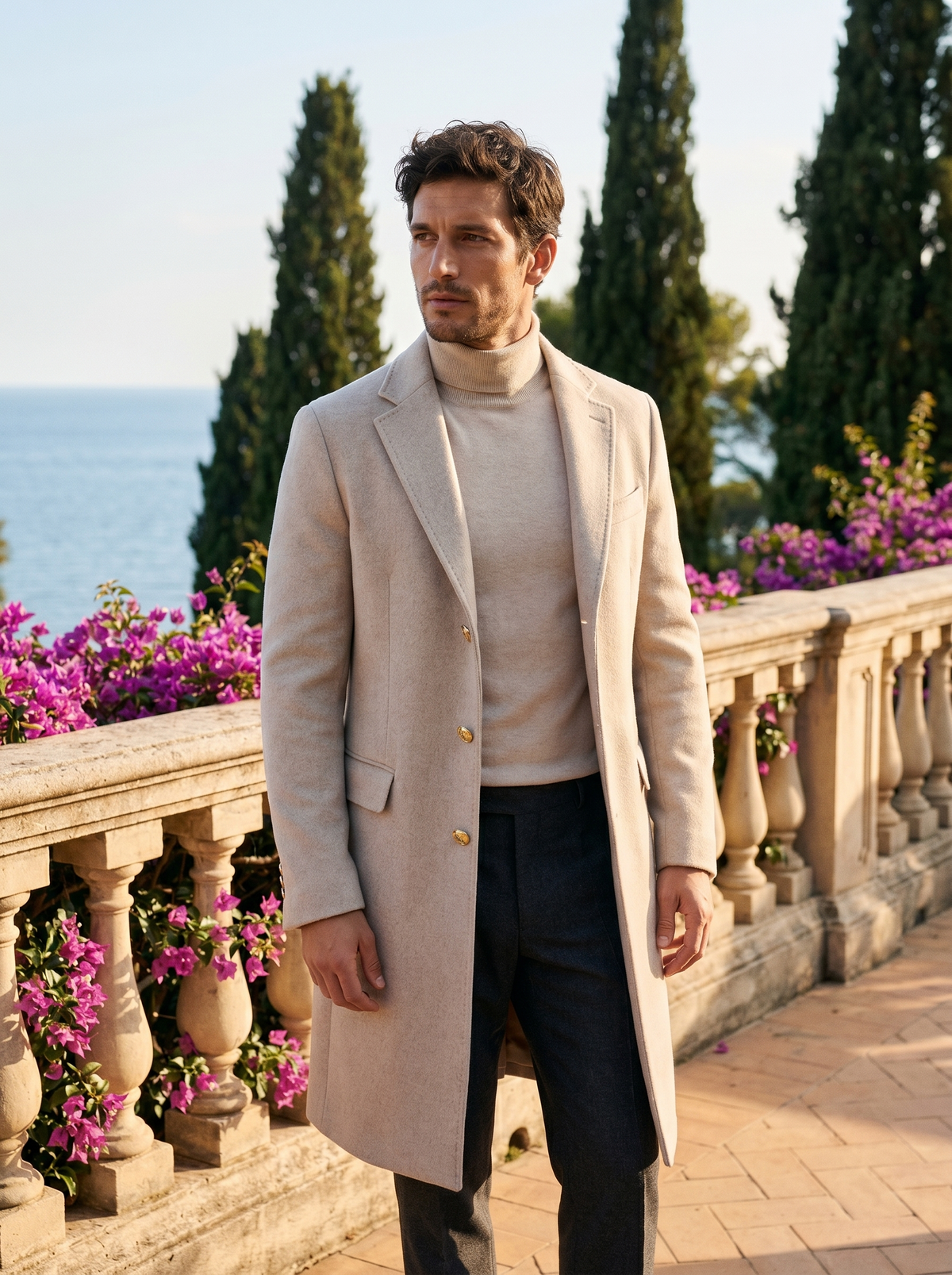 Man wearing a silver grey single-breasted tailored coat on a balcony overlooking Lake Como, old money style — Belvoirne