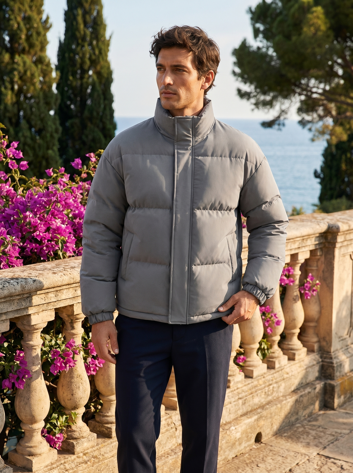 Full-length shot of a man in a puffer jacket by Lake Como — Belvoirne